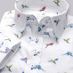 Biała bluzka w kolorowe papugi
