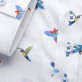 Biała bluzka w kolorowe papugi