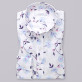 Biała bluzka w błękitne kwiaty